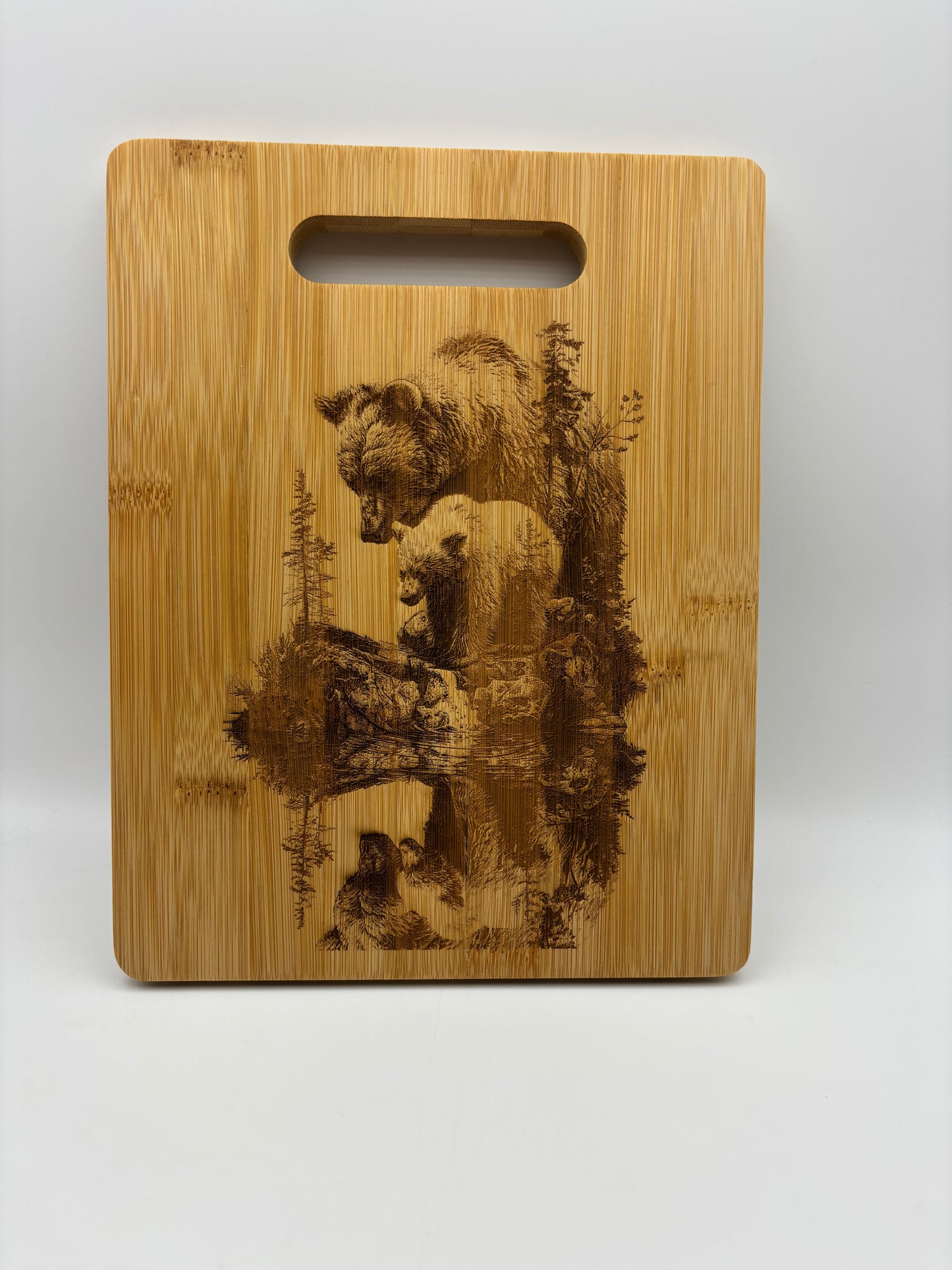 Bamboo cutting board with a mother bear and her cubs