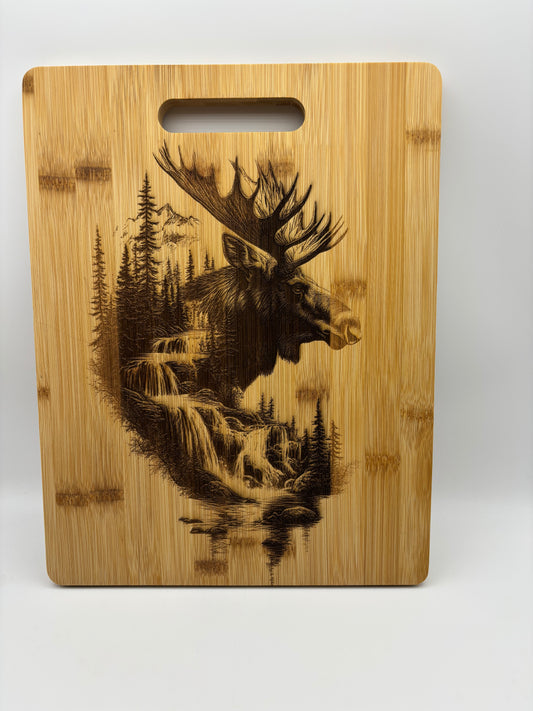 Bamboo cutting board with Moose scene engraved on it