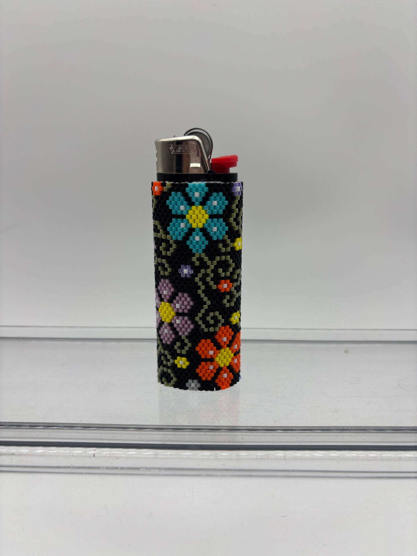 Flower beaded lighter cover.