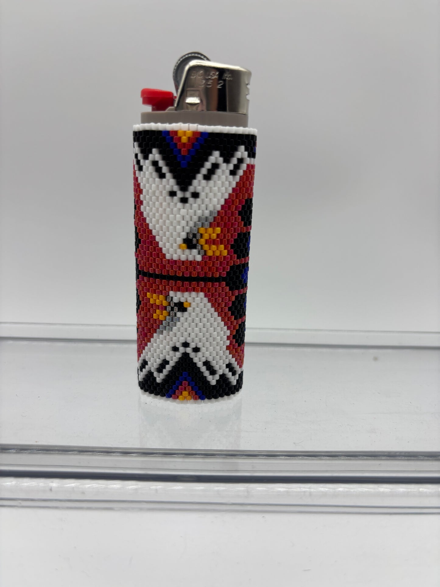 Indian inspired beaded lighter cover.