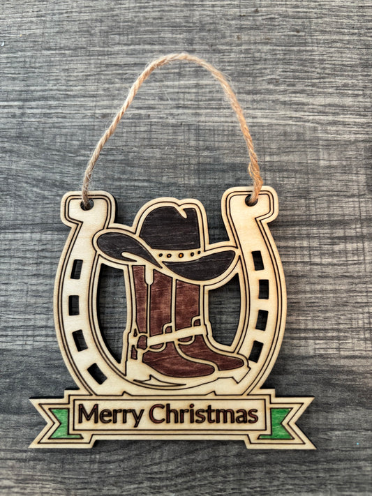 Cowboy hat and boots with horse shoe
