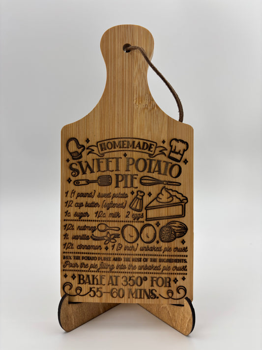 Small cutting board with a Sweet Potato Pie recipe engraved.