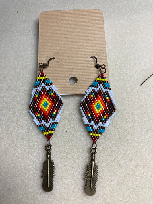 Beaded earrings with feather dangle