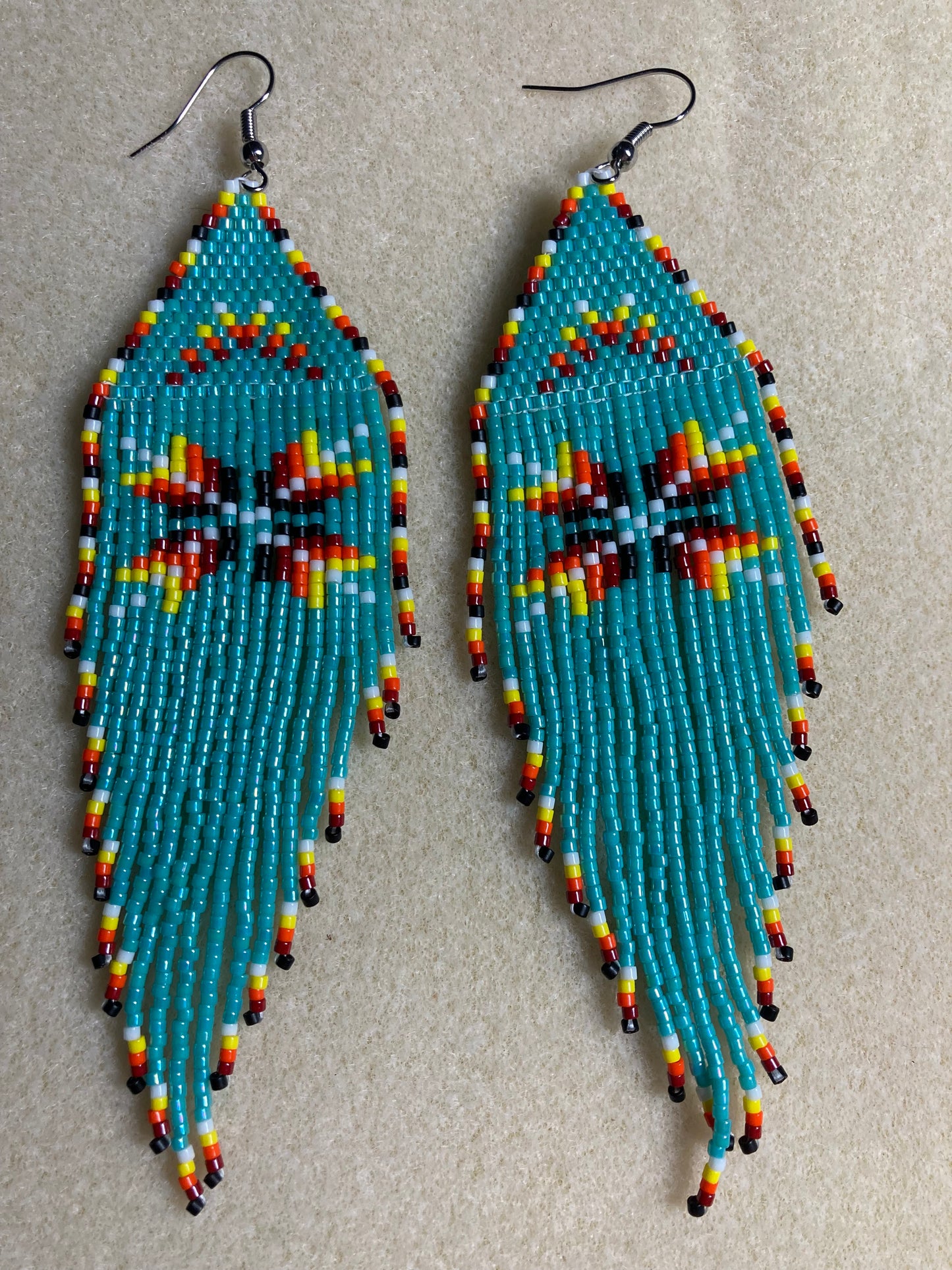 Beaded earring with fringe